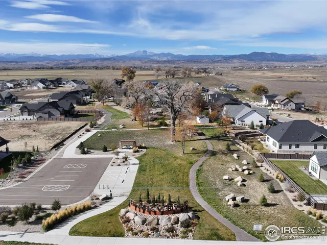 an aerial view of a residential building with outdoor space