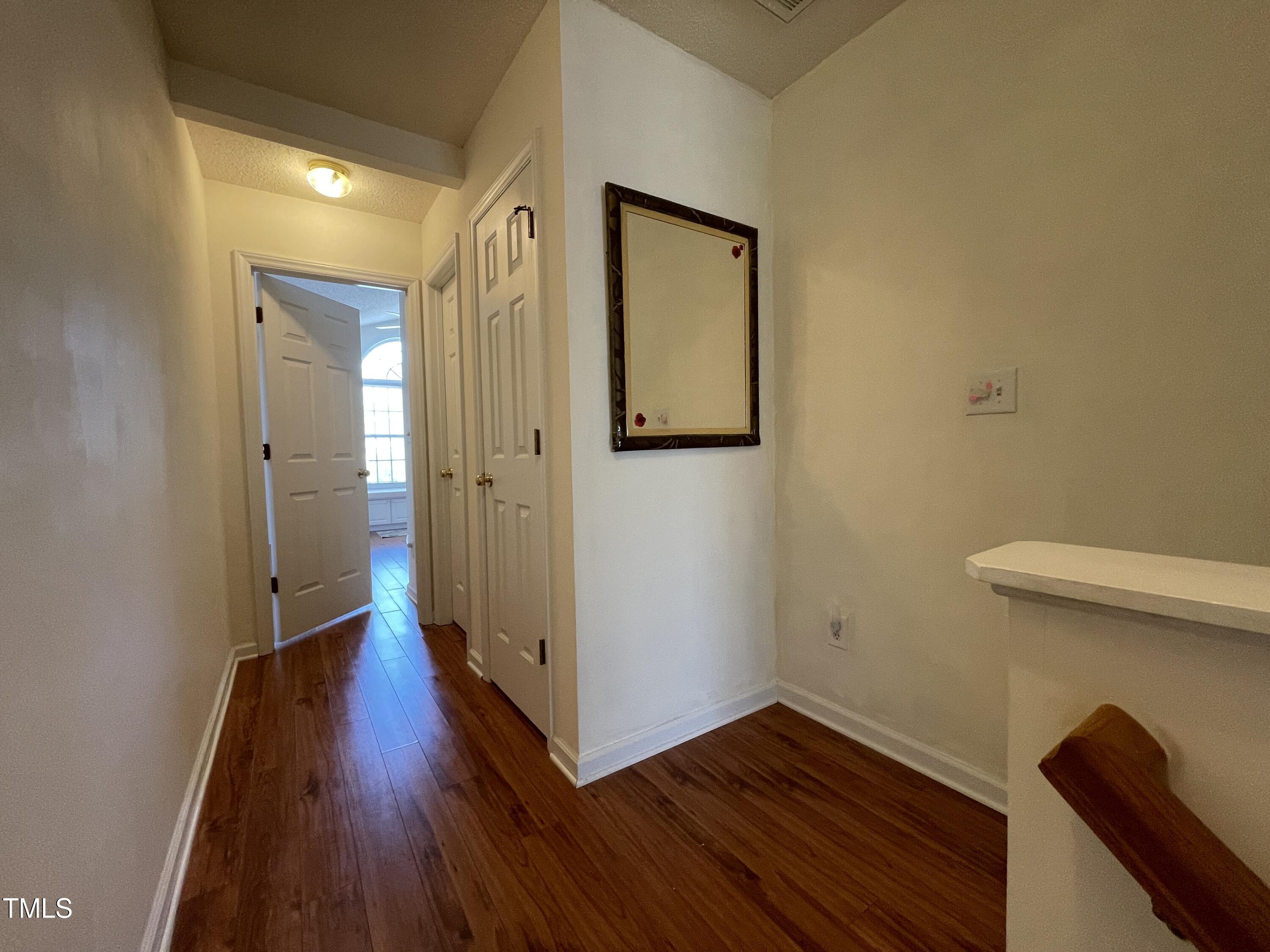 2041 Metacomet Way Raleigh, NC 27604 - Photo 38 of 67 a view of a hallway with wooden floor