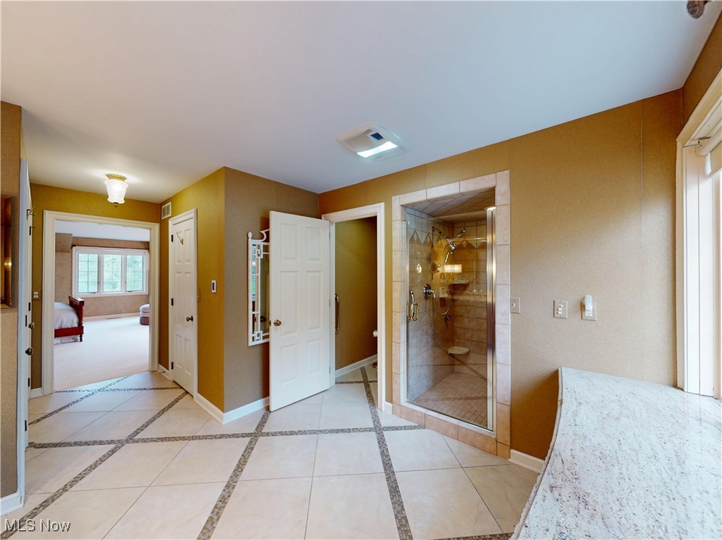 9870 Hobart Road Willoughby, OH 44094 - Photo 33 of 50 Full bathroom featuring baseboards, a shower stall, ensuite bath, and visible vents