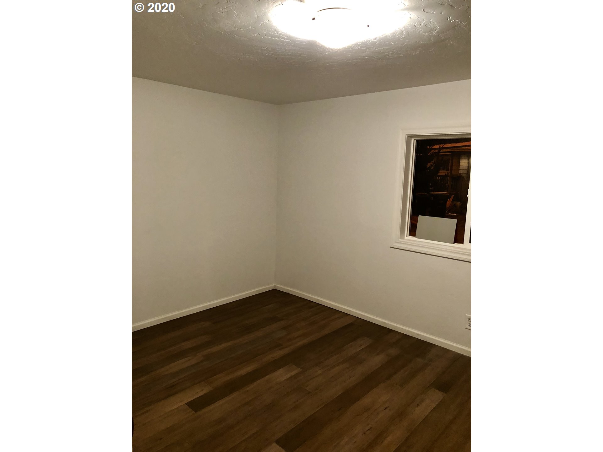 96465 Coverdell Road Brookings, OR 97415 - Photo 14 of 17 a view of an empty room with wooden floor
