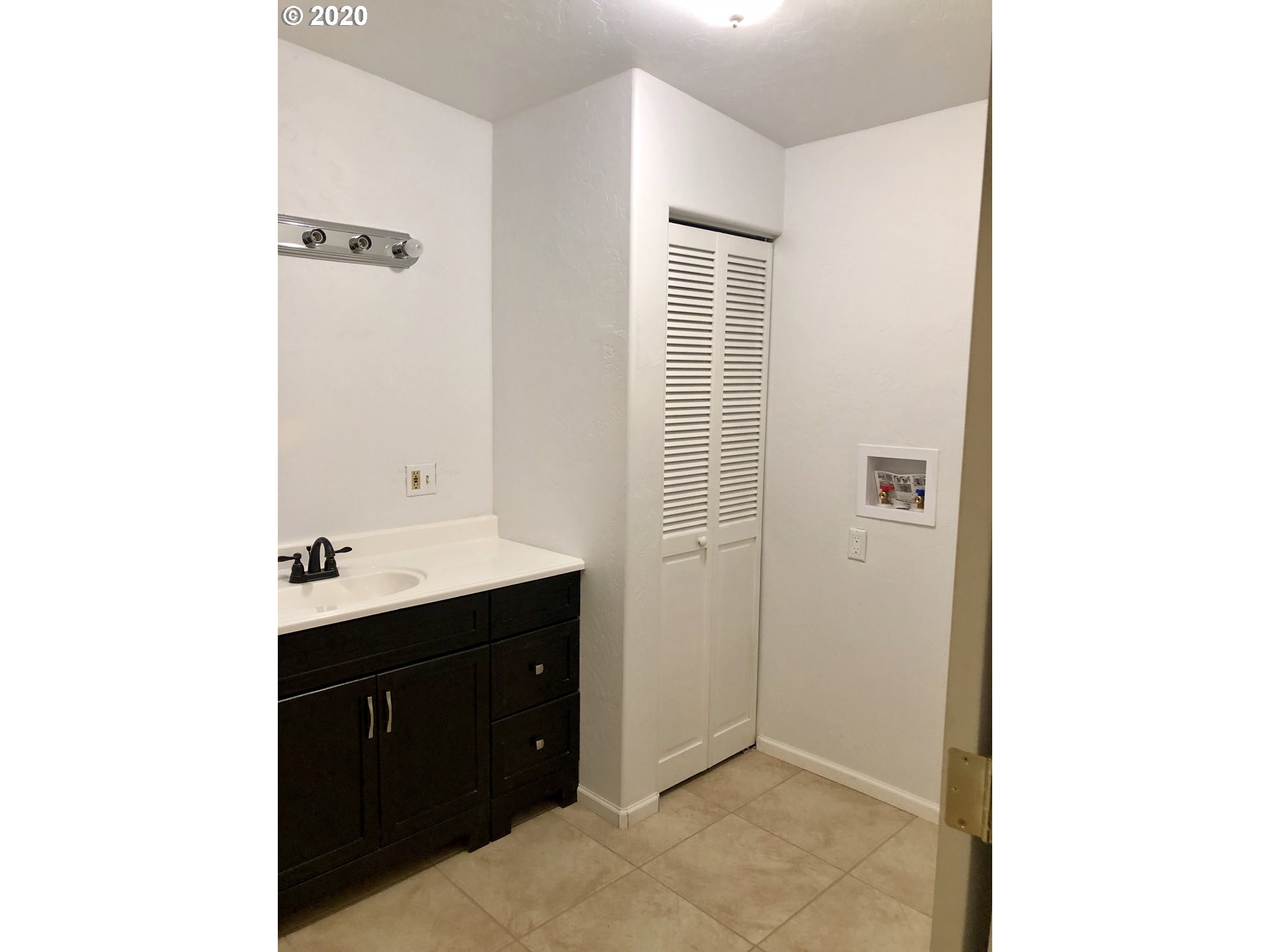 96465 Coverdell Road Brookings, OR 97415 - Photo 10 of 17 a bathroom with a sink and a mirror