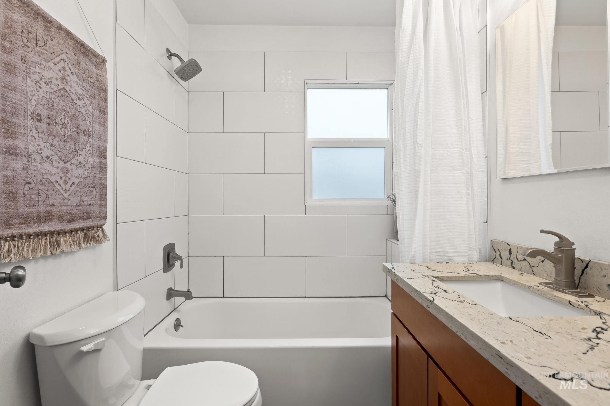 1019 North 30th Street Boise, ID 83702 - Photo 18 of 26 Full bathroom featuring vanity and shower / tub combo