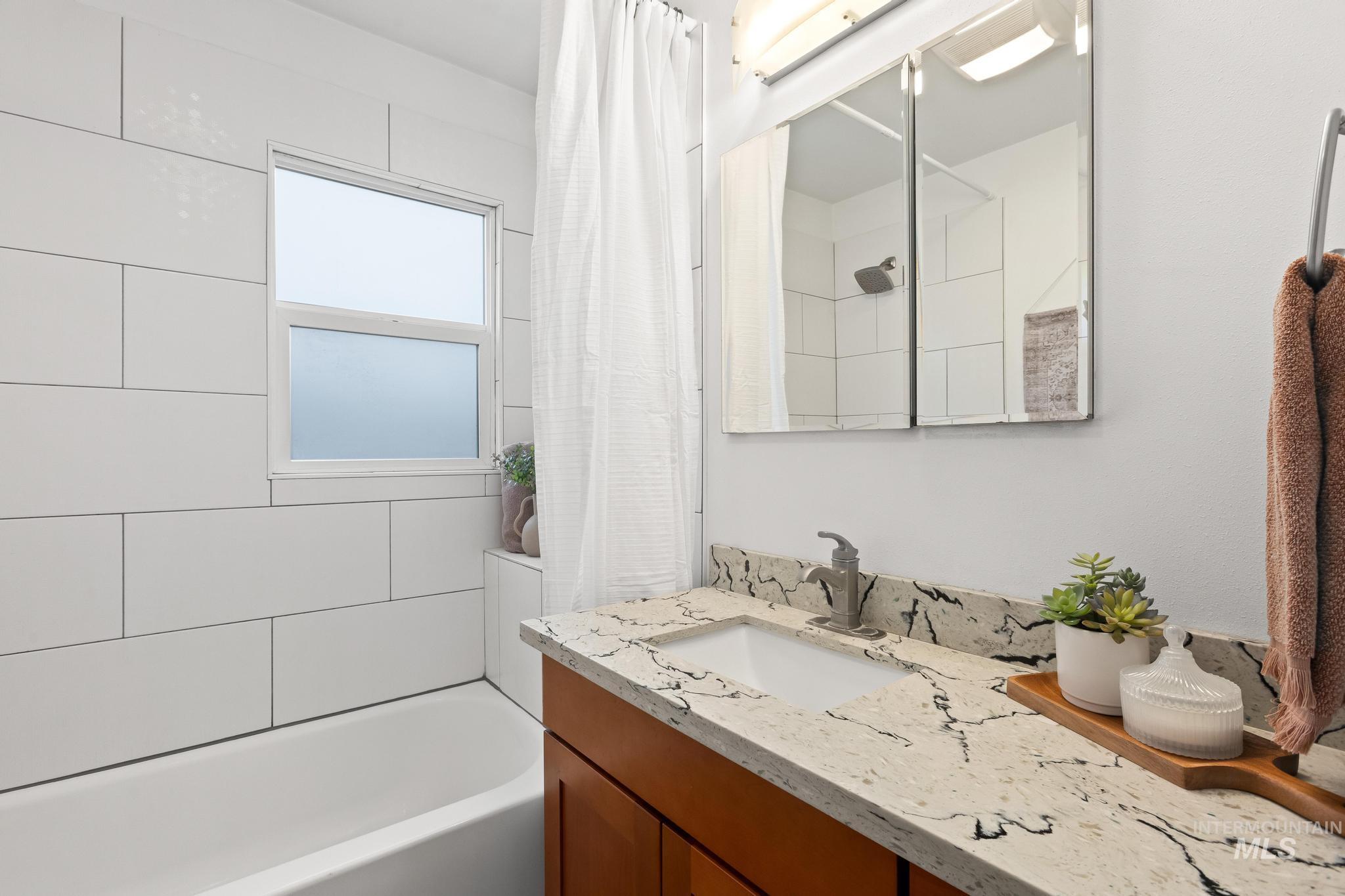 1019 North 30th Street Boise, ID 83702 - Photo 19 of 26 Full bath featuring vanity and shower / bath combination with curtain