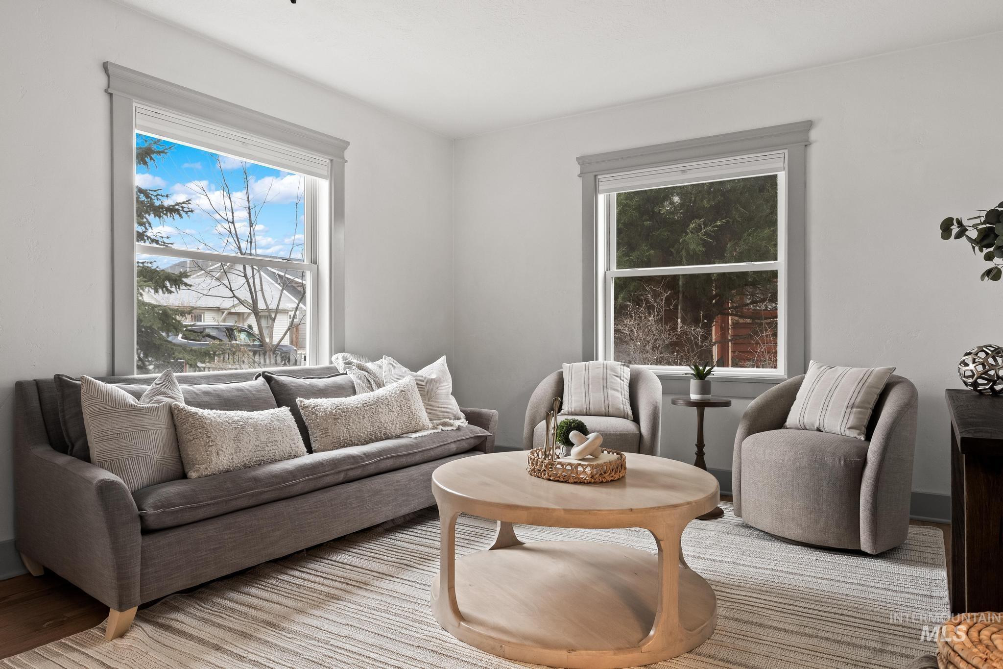 1019 North 30th Street Boise, ID 83702 - Photo 6 of 26 Living room featuring baseboards and wood finished floors