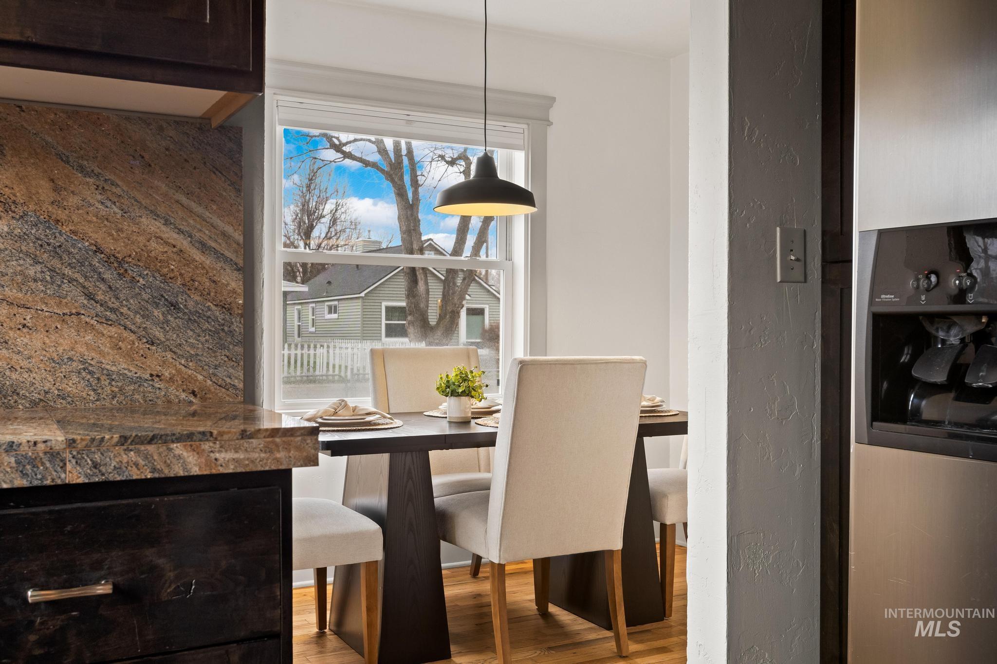 1019 North 30th Street Boise, ID 83702 - Photo 8 of 26 Dining room featuring wood finished floors and a textured wall
