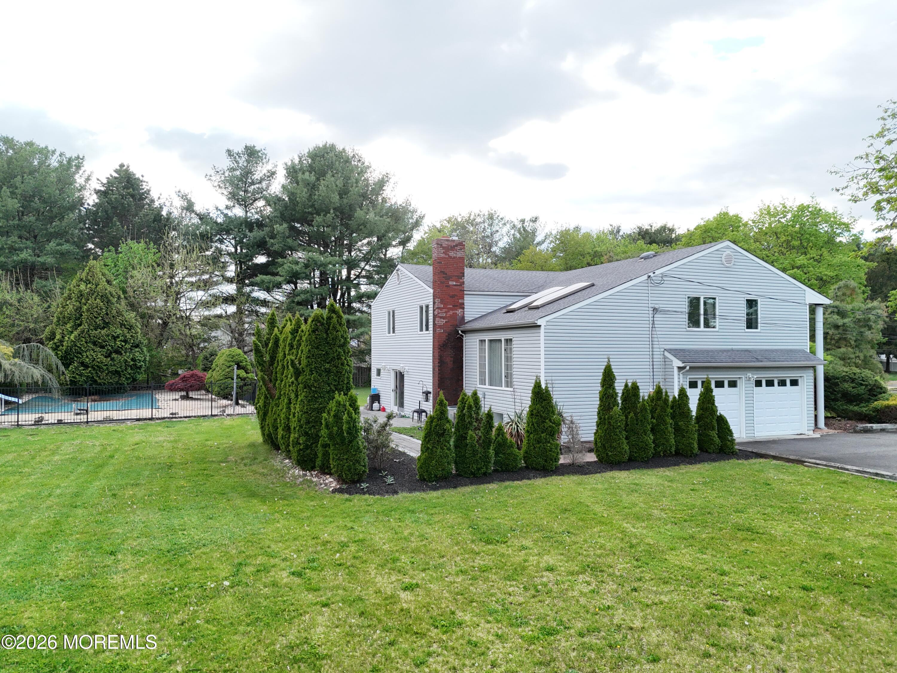1 Flintlock Road Freehold, NJ 07728 - Photo 5 of 41 Back Angle with Patio