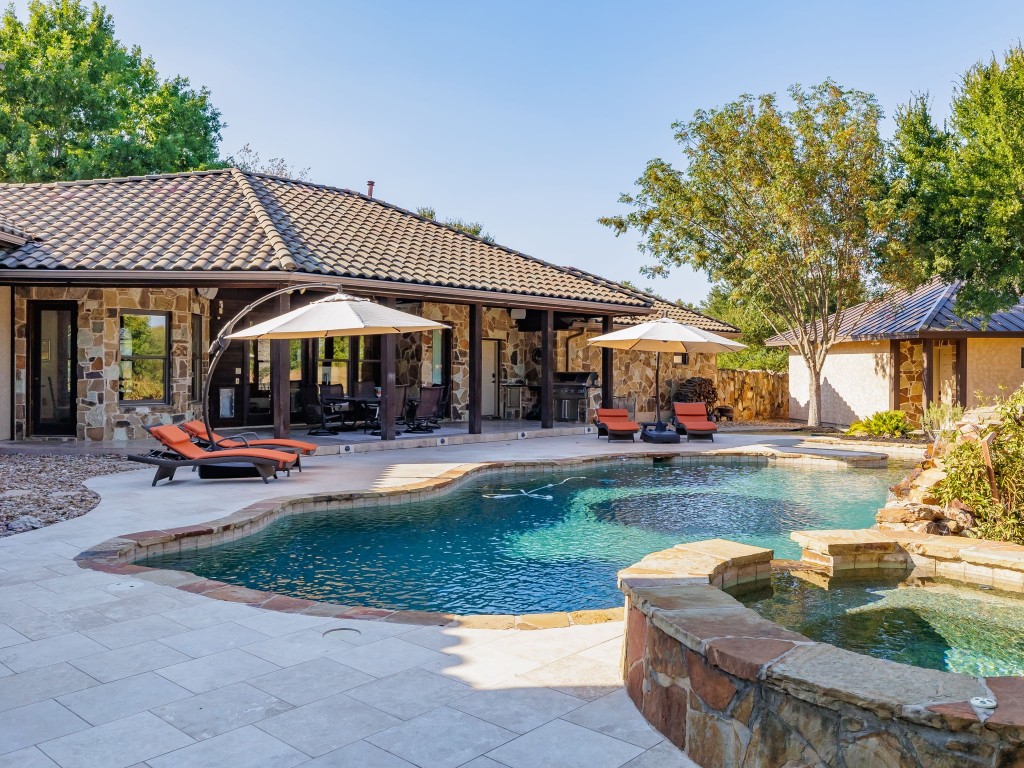 502 Indigo Lane Georgetown, TX 78628 - Photo 1 of 1 a view of a house with backyard sitting area and swimming pool