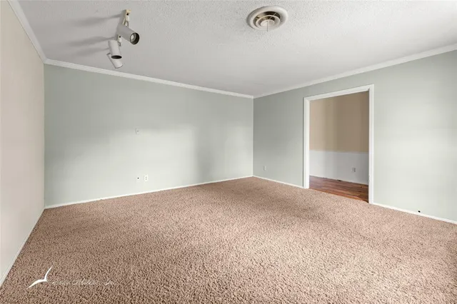 a view of empty room with windows