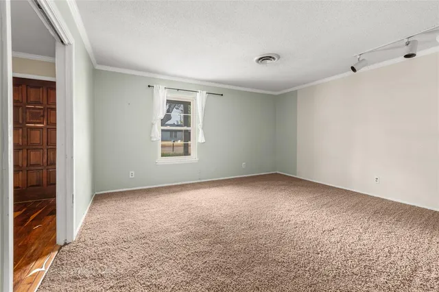wooden floor in an empty room with a fireplace