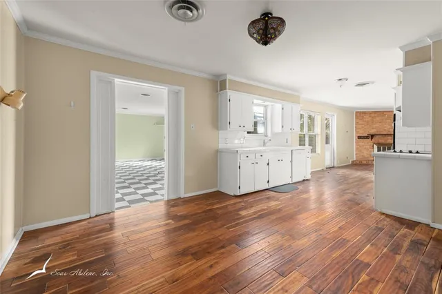 a view of a kitchen from the hallway