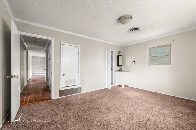 a view of a bedroom with closet area