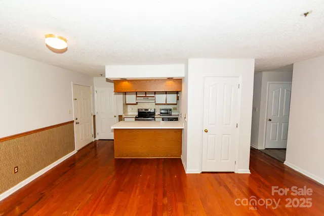 a view of kitchen with wooden floor