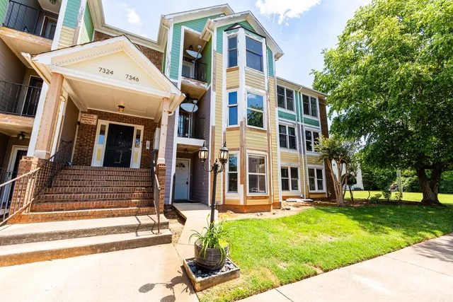 a view of a car parked in front of a house