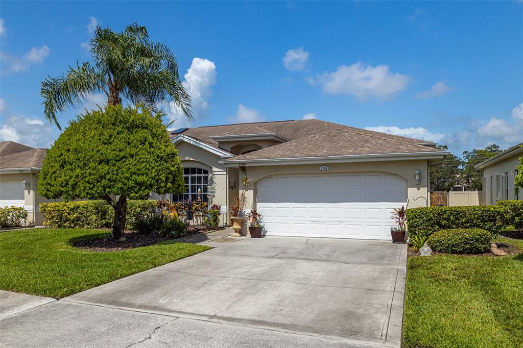 2790 Country Way Clearwater, FL 33763 - Photo 1 of 1 a front view of a house with a yard and garage
