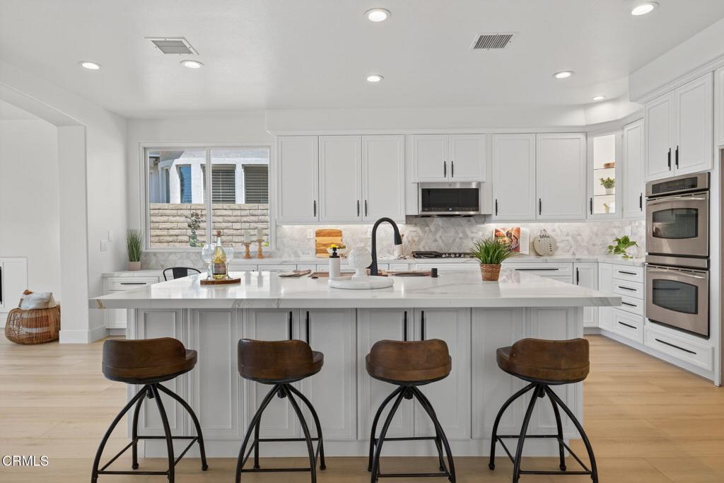 2967 Avenida De Autlan Camarillo, CA 93010 - Photo 16 of 78 a kitchen with stainless steel appliances a stove a sink and a refrigerator