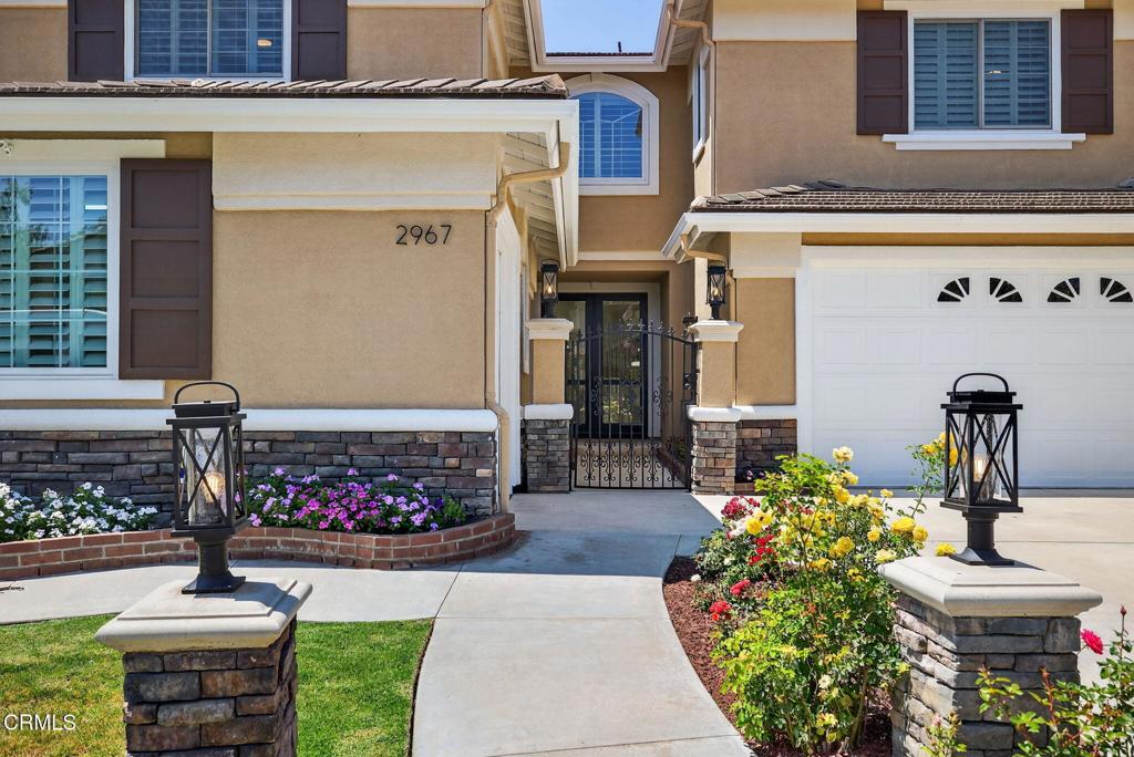 2967 Avenida De Autlan Camarillo, CA 93010 - Photo 4 of 78 a front view of a house with a garden