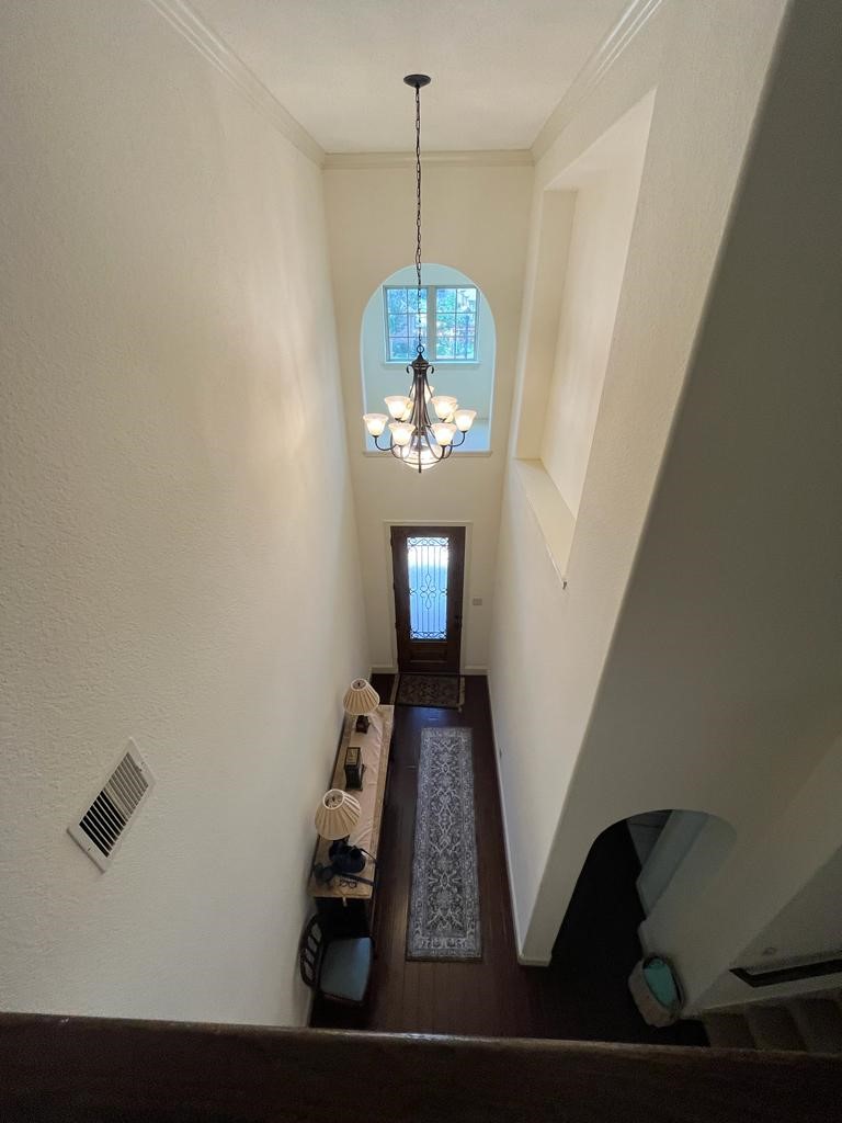13117 Stoneleigh Terrace Drive Houston, TX 77077 - Photo 11 of 23 a view of a hallway with wooden floor and staircase