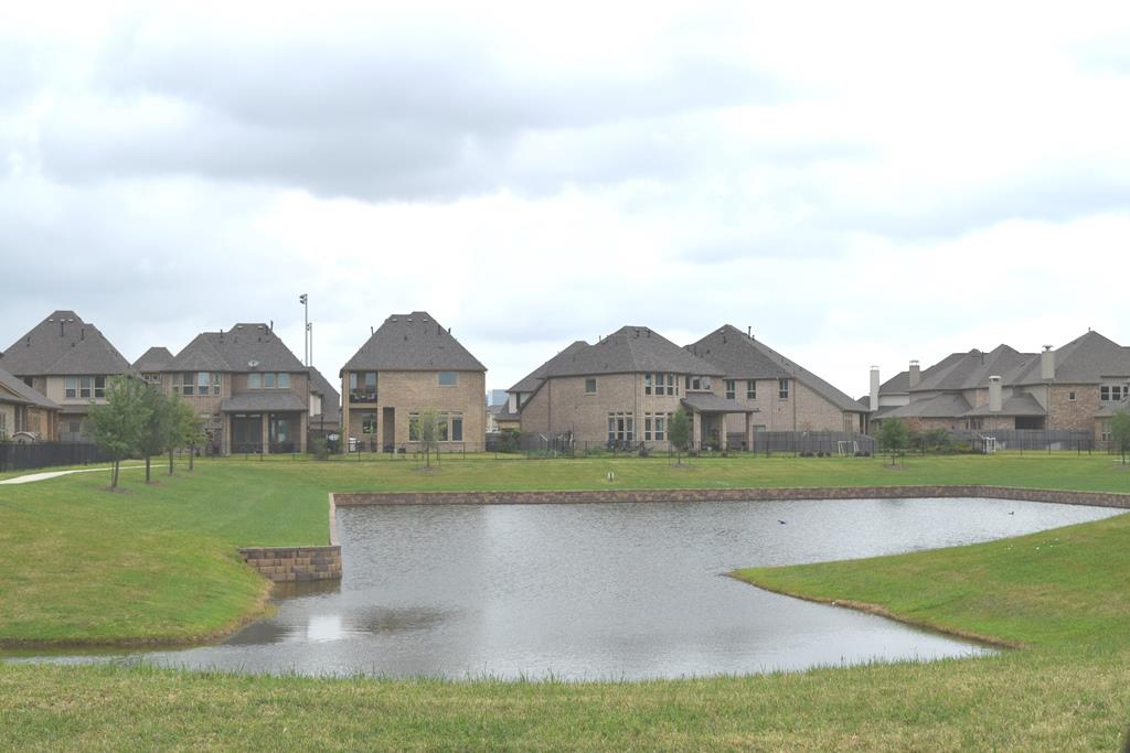 13117 Stoneleigh Terrace Drive Houston, TX 77077 - Photo 17 of 23 a front view of a house with a yard and garage