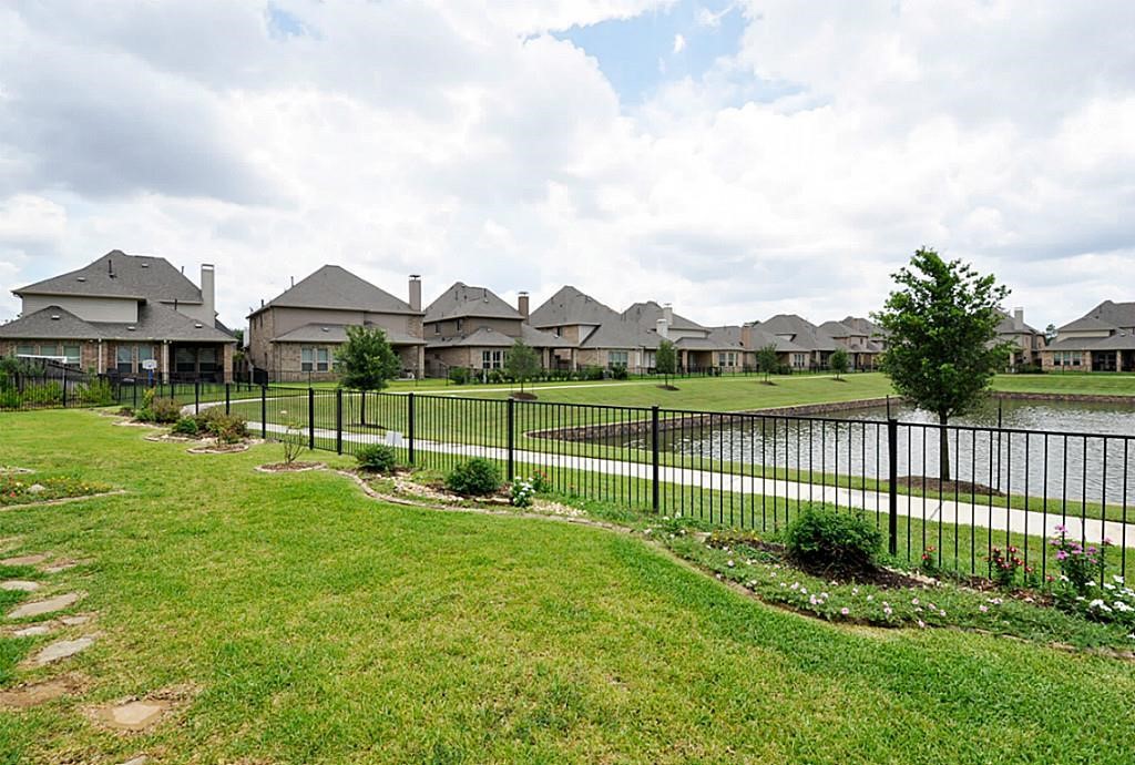 13117 Stoneleigh Terrace Drive Houston, TX 77077 - Photo 19 of 23 a view of a green field with a small yard