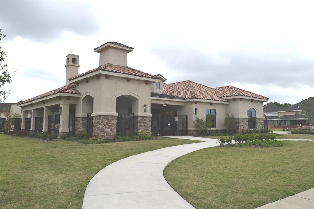 13117 Stoneleigh Terrace Drive Houston, TX 77077 - Photo 20 of 23 a view of a white house with a yard and plants