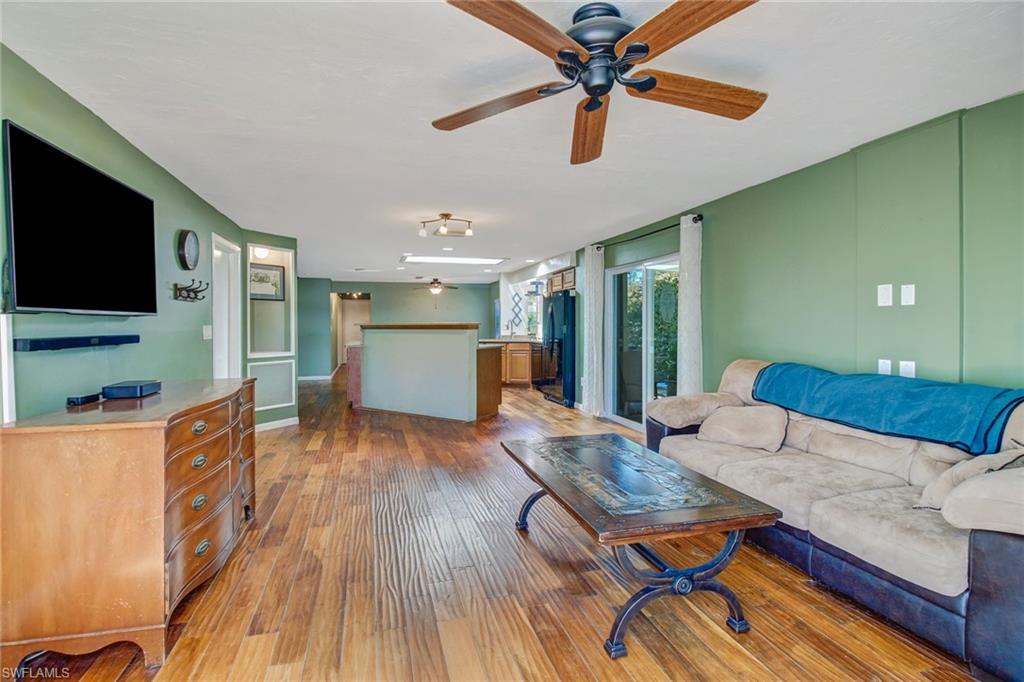 842 Roseate Drive Naples, FL 34104 - Photo 14 of 33 a living room with furniture and a flat screen tv
