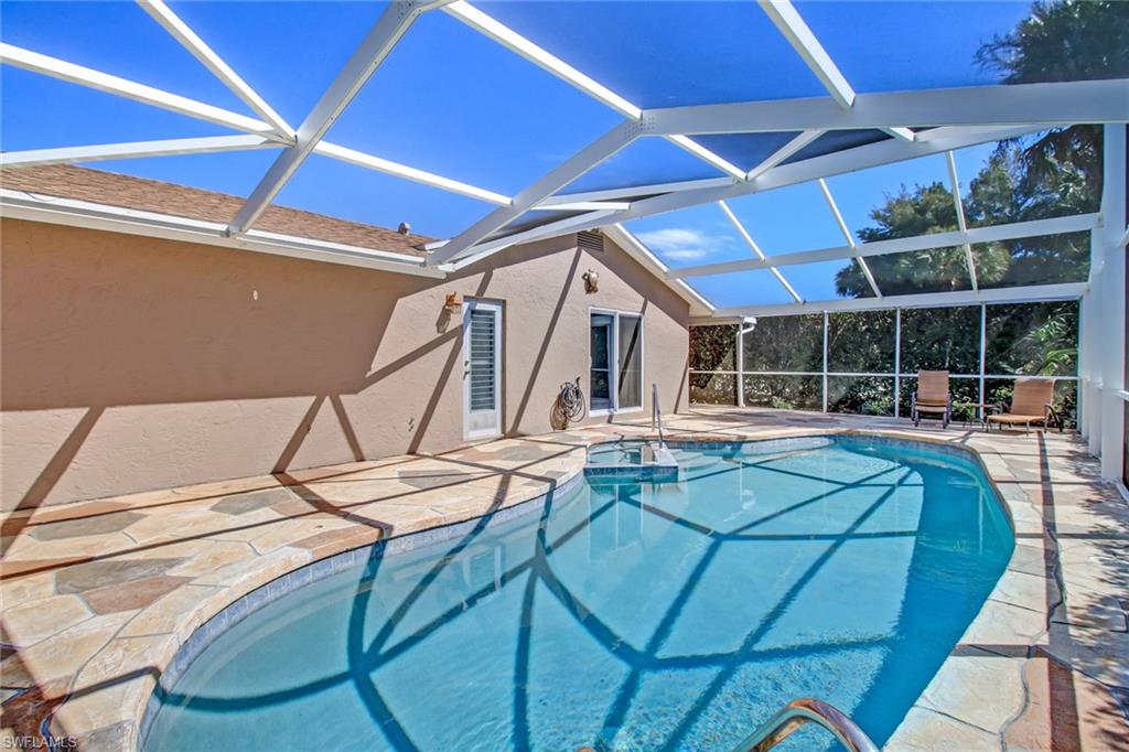 842 Roseate Drive Naples, FL 34104 - Photo 23 of 33 a view of swimming pool with seating area