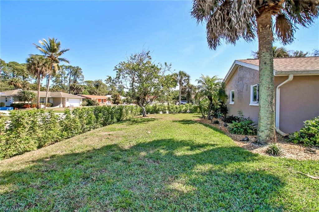 842 Roseate Drive Naples, FL 34104 - Photo 29 of 33 a view of back yard of a house