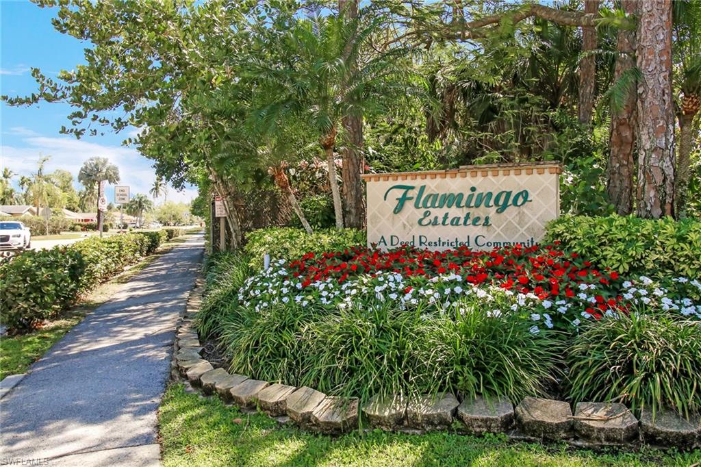 842 Roseate Drive Naples, FL 34104 - Photo 33 of 33 a sign on the side of a road