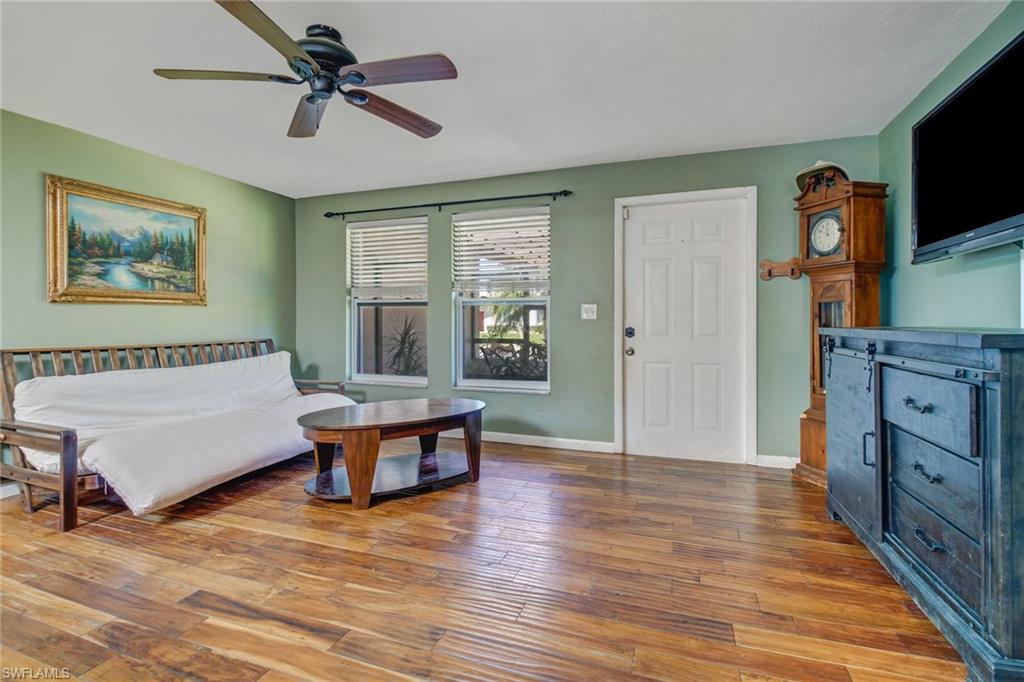 842 Roseate Drive Naples, FL 34104 - Photo 5 of 33 a spacious bedroom with a bed and a flat screen tv