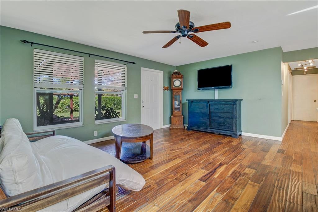 842 Roseate Drive Naples, FL 34104 - Photo 6 of 33 a living room with furniture and a flat screen tv