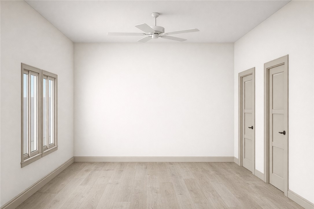 2576 Shady Rte Lane Bryan, TX 77803 - Photo 10 of 18 an empty room with a window and a fan
