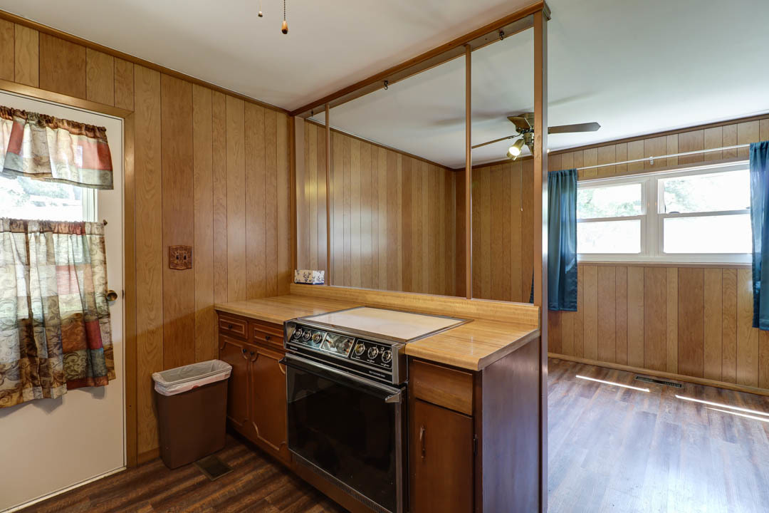29 Pine Circle Tuscola, IL 61953 - Photo 12 of 27 a kitchen with a stove and a wooden floors