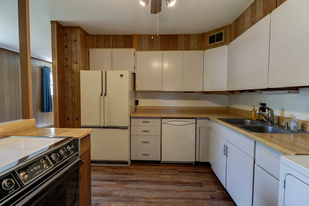 29 Pine Circle Tuscola, IL 61953 - Photo 13 of 27 a kitchen with a sink stove and refrigerator