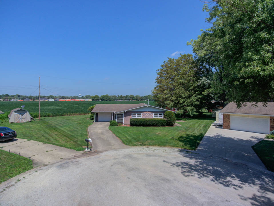 29 Pine Circle Tuscola, IL 61953 - Photo 23 of 27 a front view of a house with a yard and garage