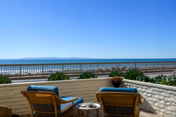 a view of a garden with a lake in front of it