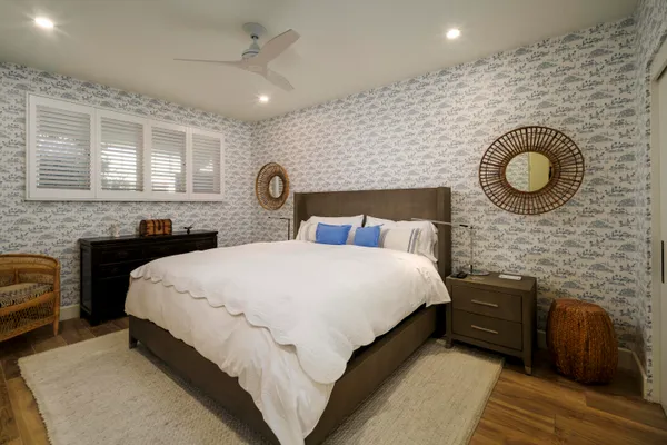 a bedroom with a bed and a dresser