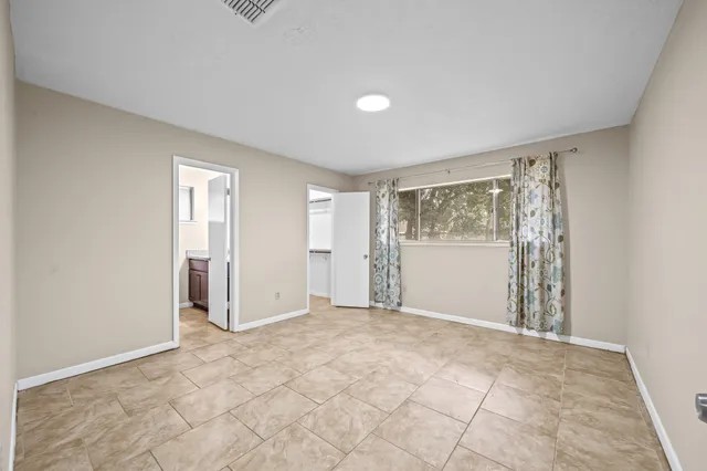 a view of an empty room with a window