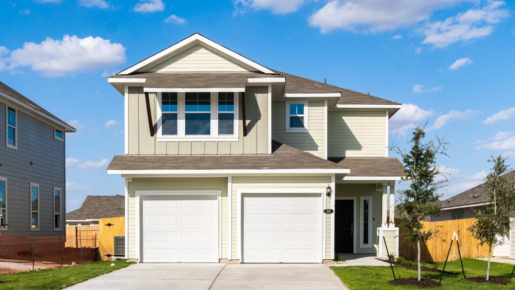 View of front of home featuring driveway, a garage, a shingled roof, and board and batten siding