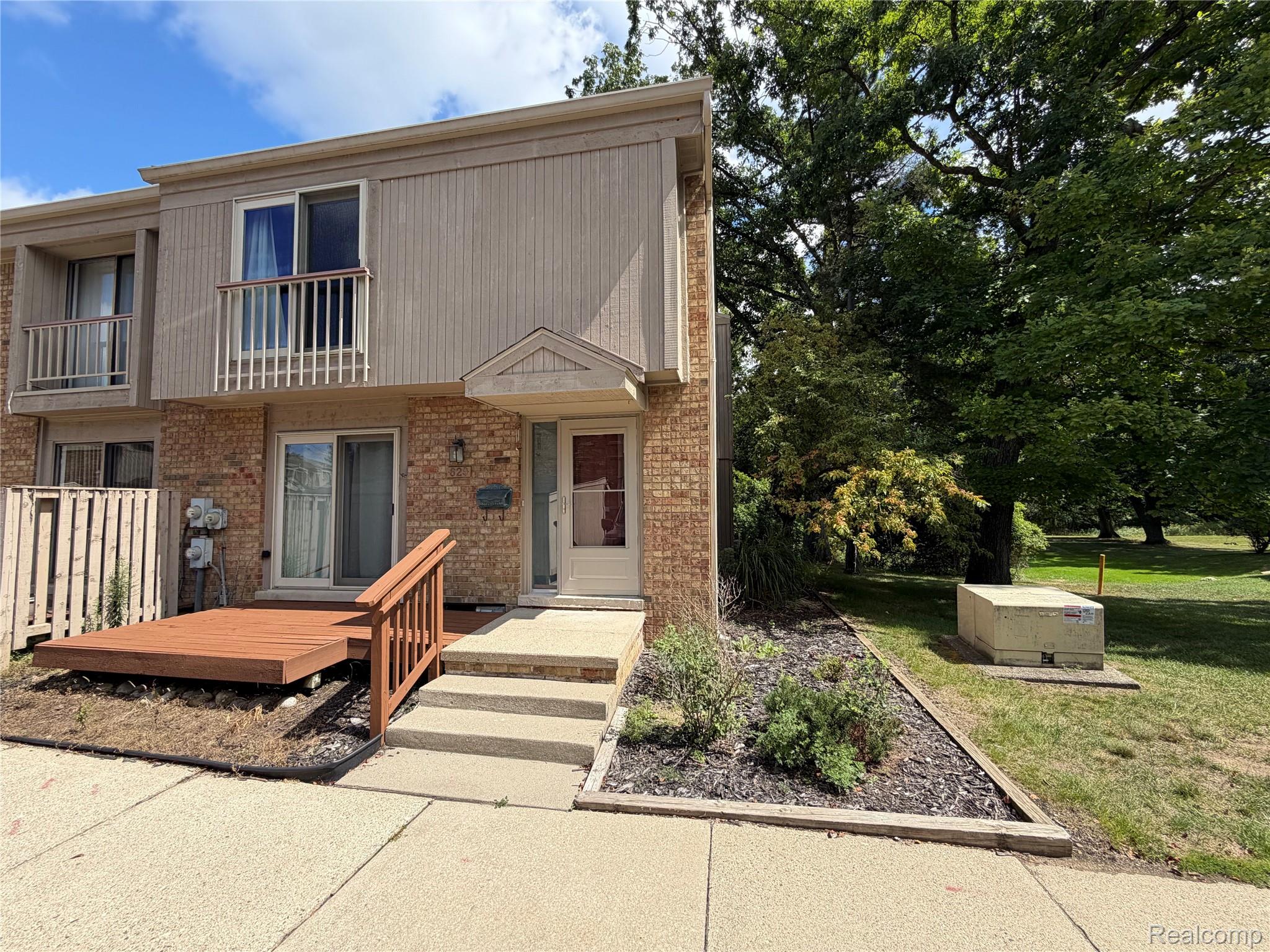 629 Oakbrook West, Unit 18 Rochester, MI 48307 - Photo 1 of 22 Brick and siding exterior with a second-story balcony