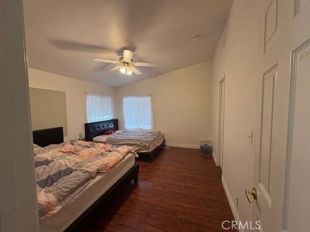 33979 Fremont Road Newberry Springs, CA 92365 - Photo 14 of 16 a bedroom with a bed and a chandelier