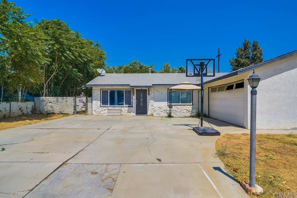 6215 Rustic Lane Riverside, CA 92509 - Photo 1 of 1 a view of a house with backyard and sitting area