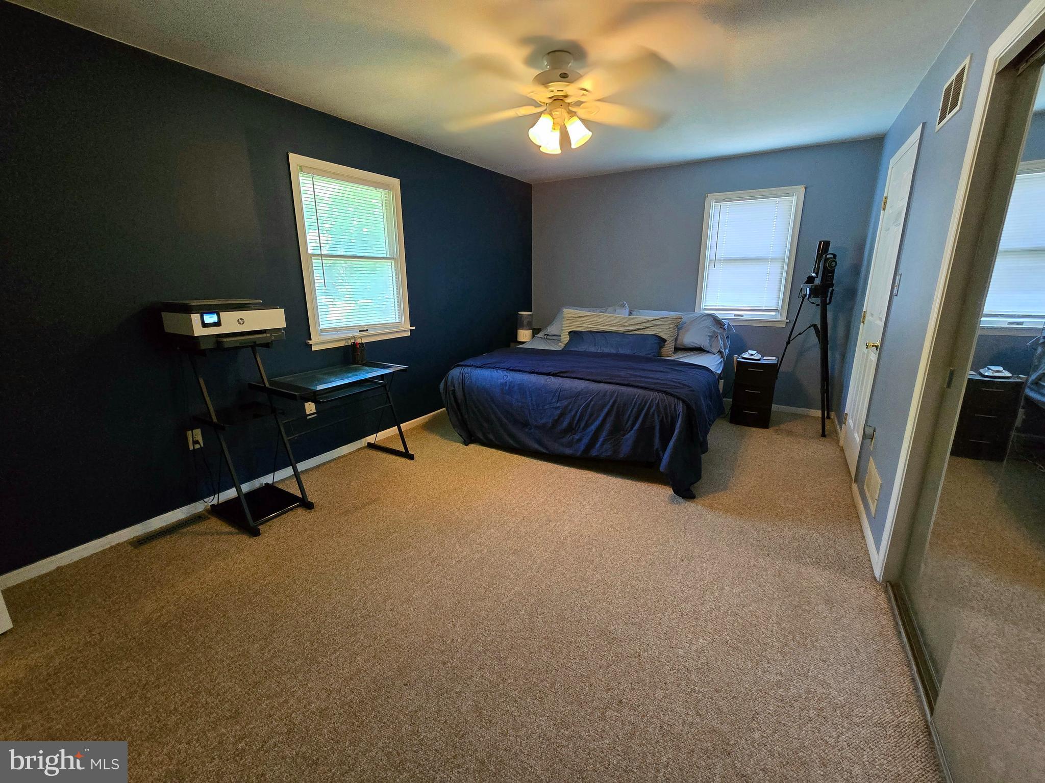 100 Constitution Avenue Reading, PA 19606 - Photo 14 of 35 a spacious bedroom with a bed and a chandelier