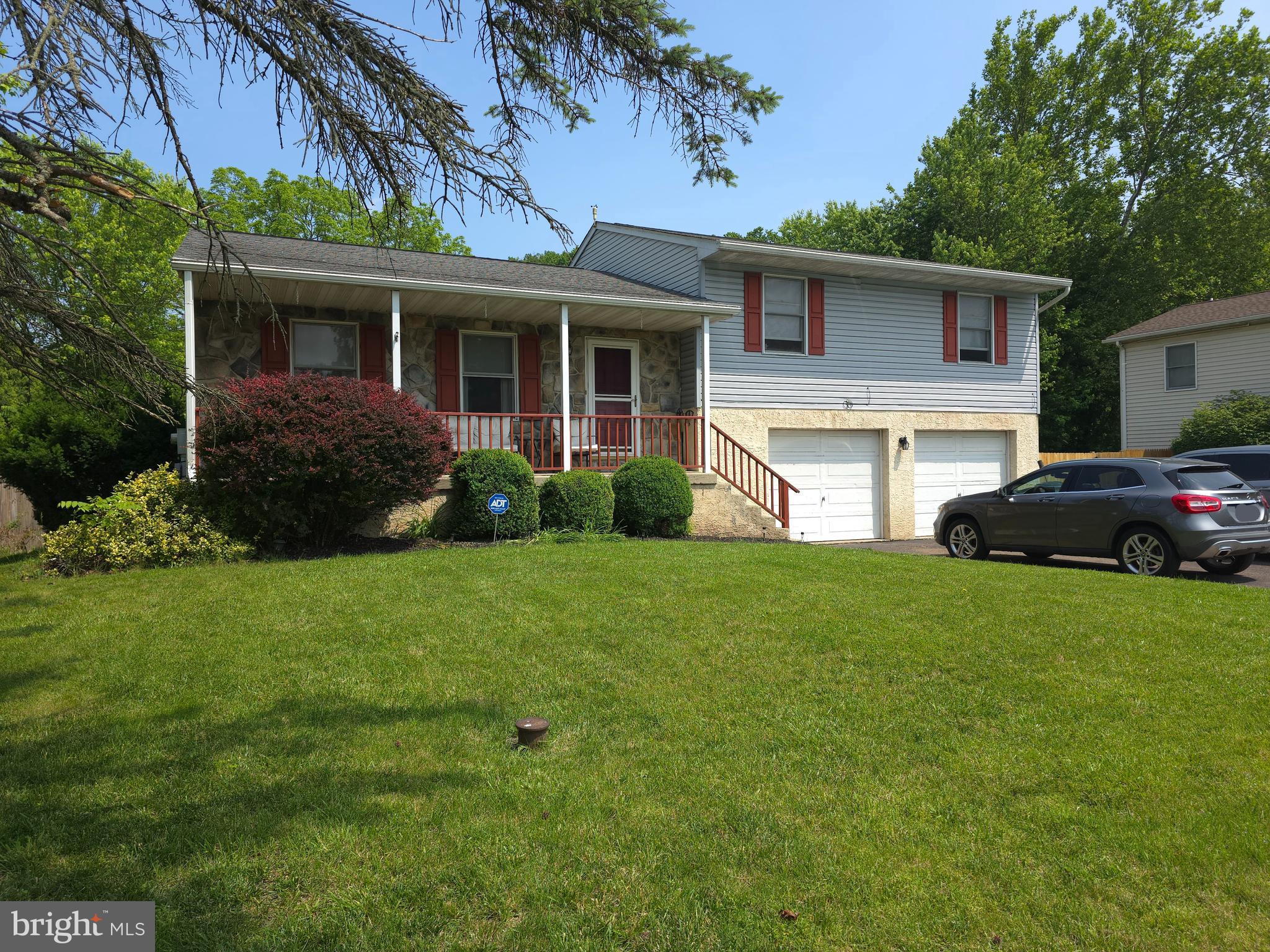 100 Constitution Avenue Reading, PA 19606 - Photo 2 of 35 a front view of a house with a garden