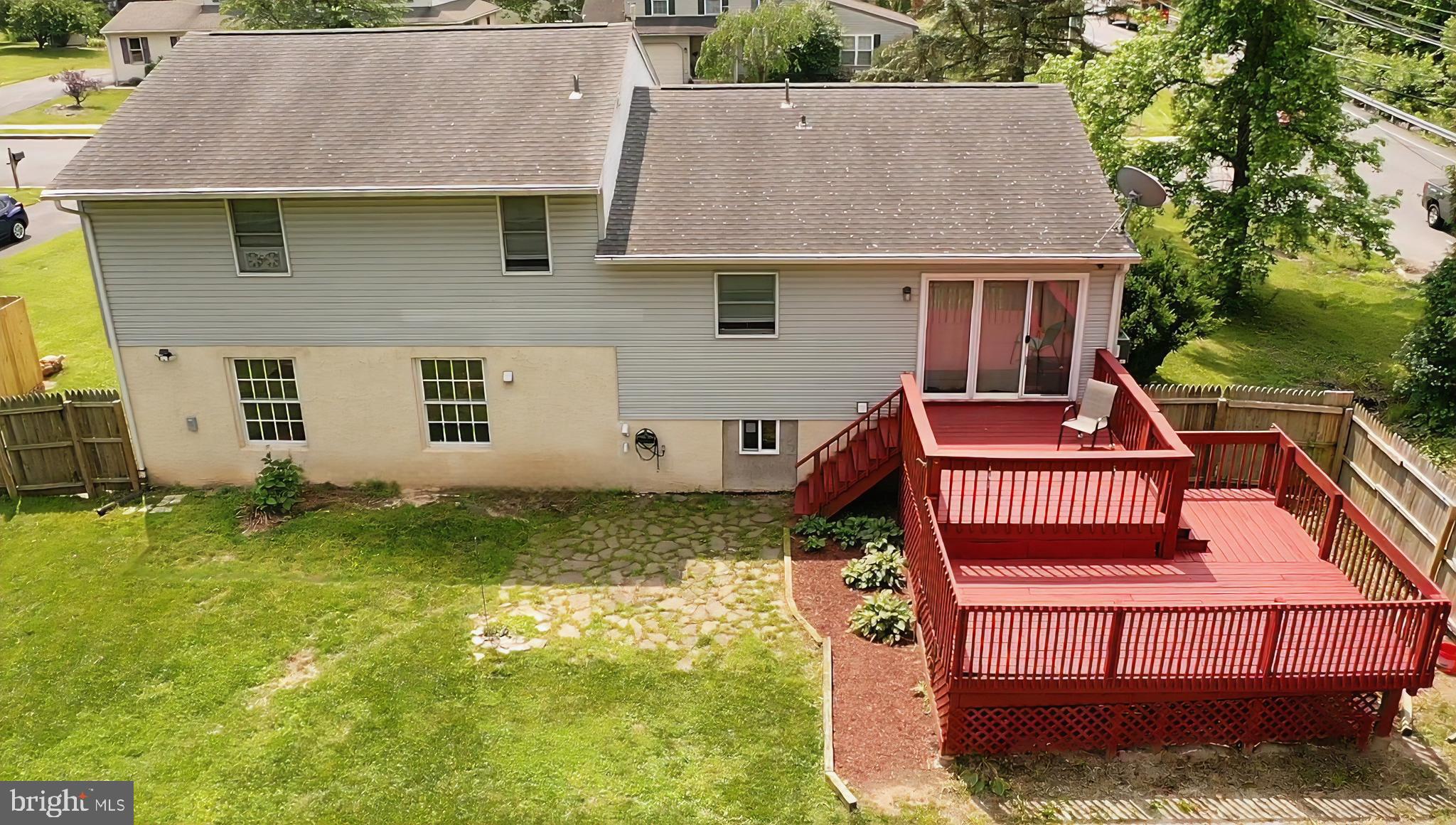100 Constitution Avenue Reading, PA 19606 - Photo 26 of 35 an aerial view of a house with swimming pool and deck