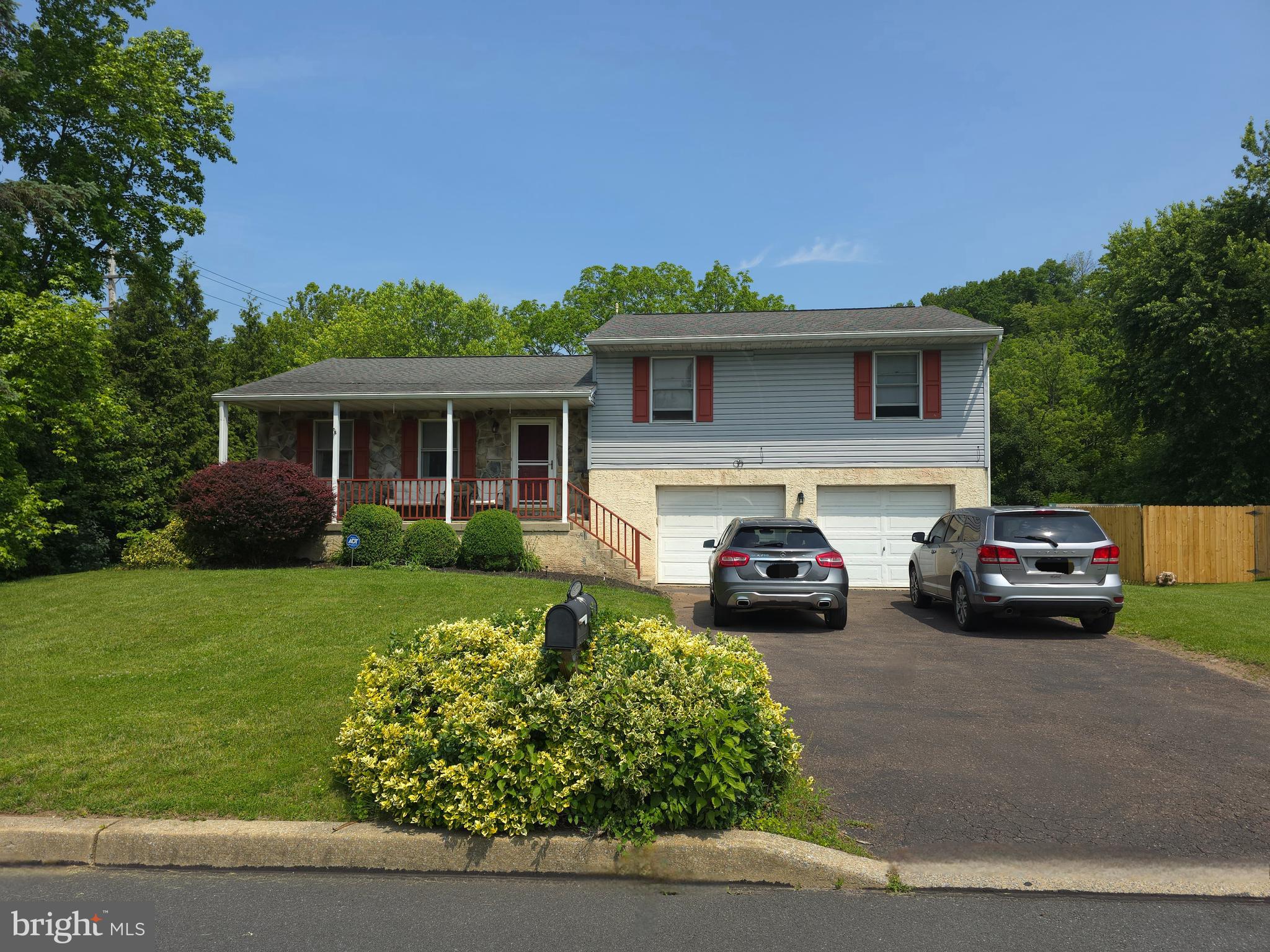 100 Constitution Avenue Reading, PA 19606 - Photo 3 of 35 a front view of a house with a garden