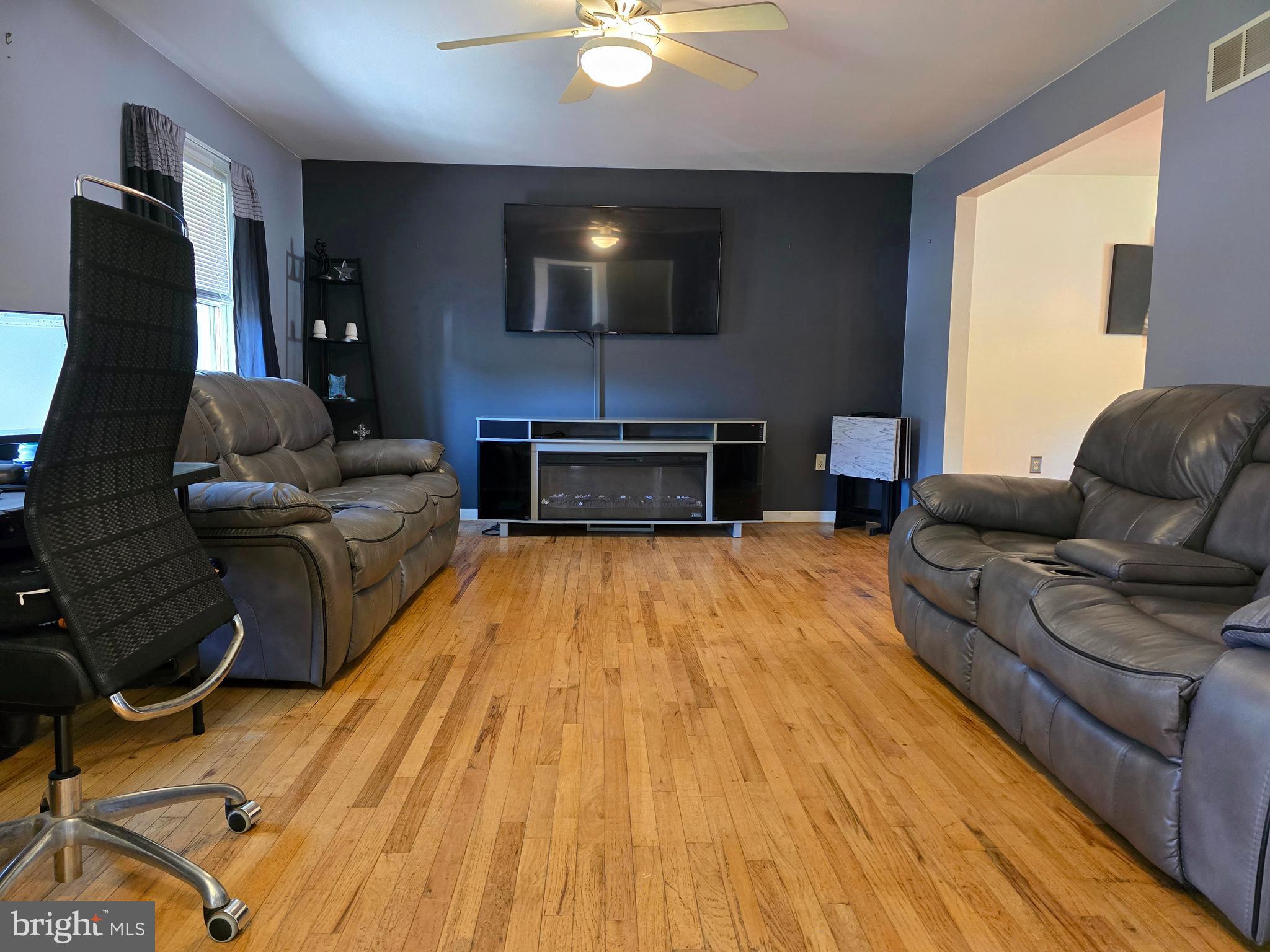 100 Constitution Avenue Reading, PA 19606 - Photo 5 of 35 a living room with furniture and a flat screen tv
