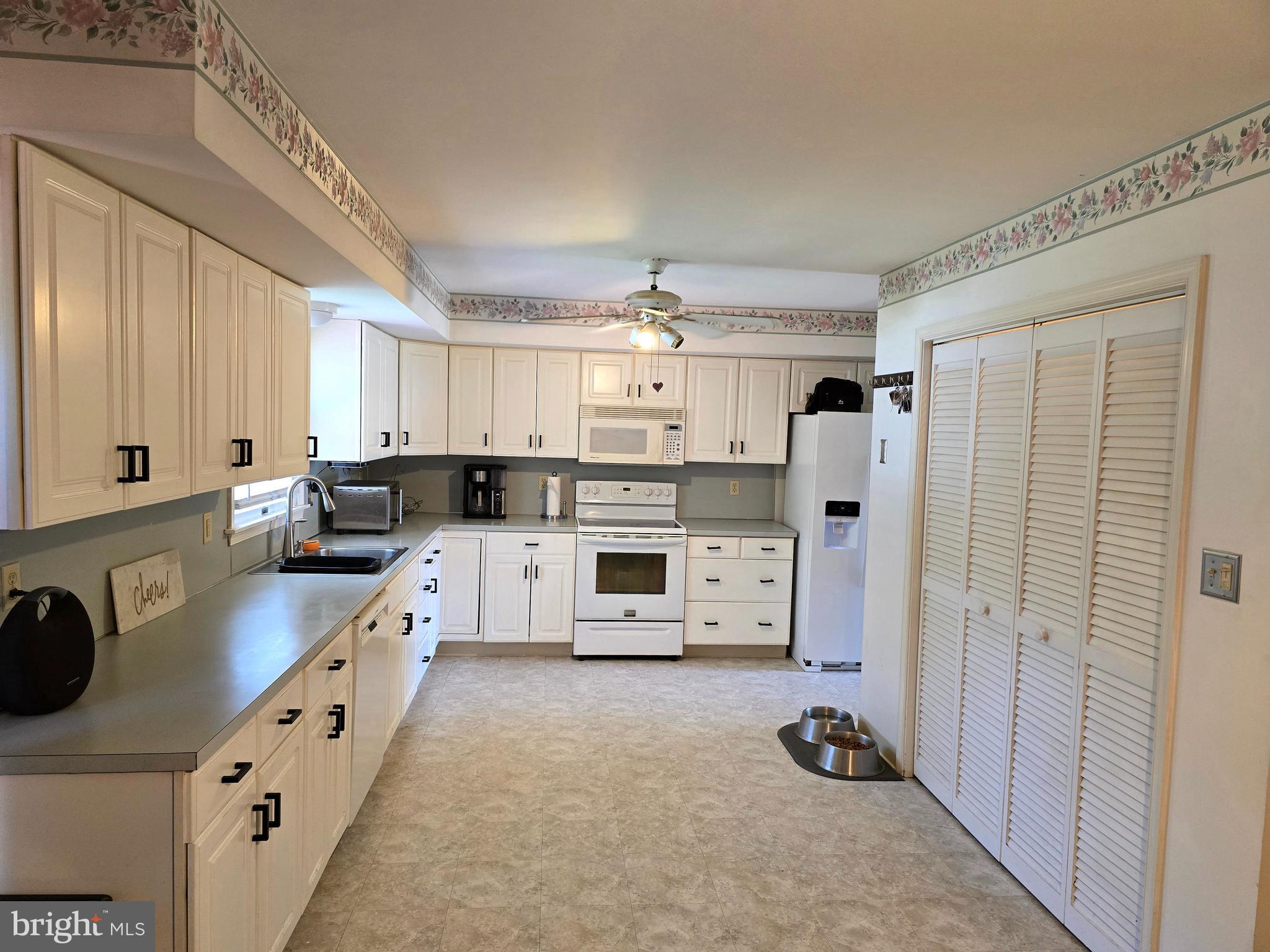 100 Constitution Avenue Reading, PA 19606 - Photo 7 of 35 a kitchen with stainless steel appliances a refrigerator sink and cabinets