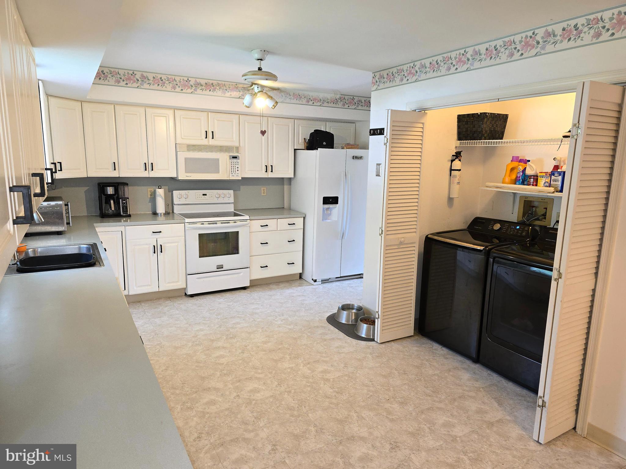 100 Constitution Avenue Reading, PA 19606 - Photo 8 of 35 a kitchen with a refrigerator and a stove