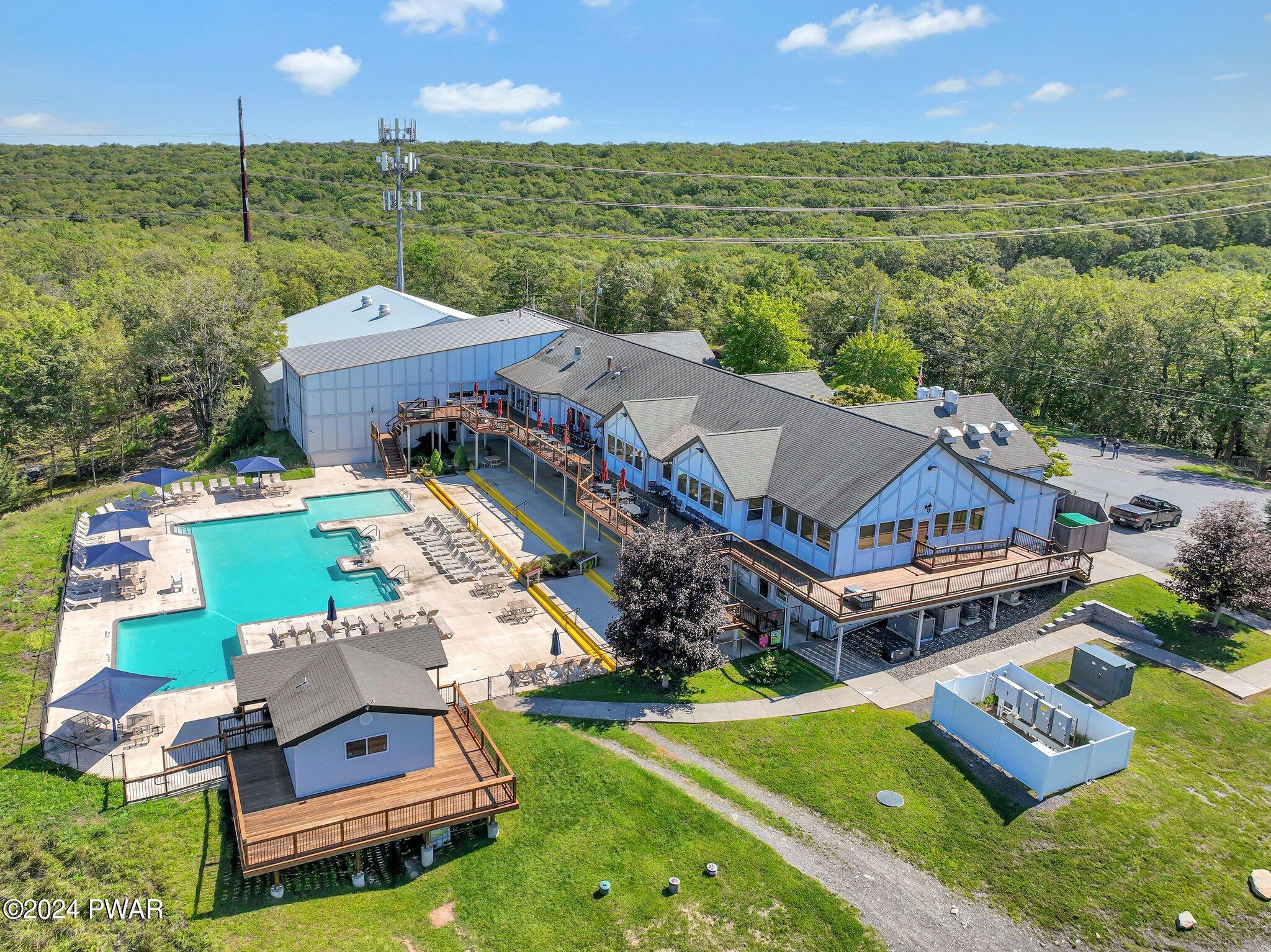 3178 Cherry Ridge Road Bushkill, PA 18324 - Photo 44 of 54 an aerial view of a house with a garden