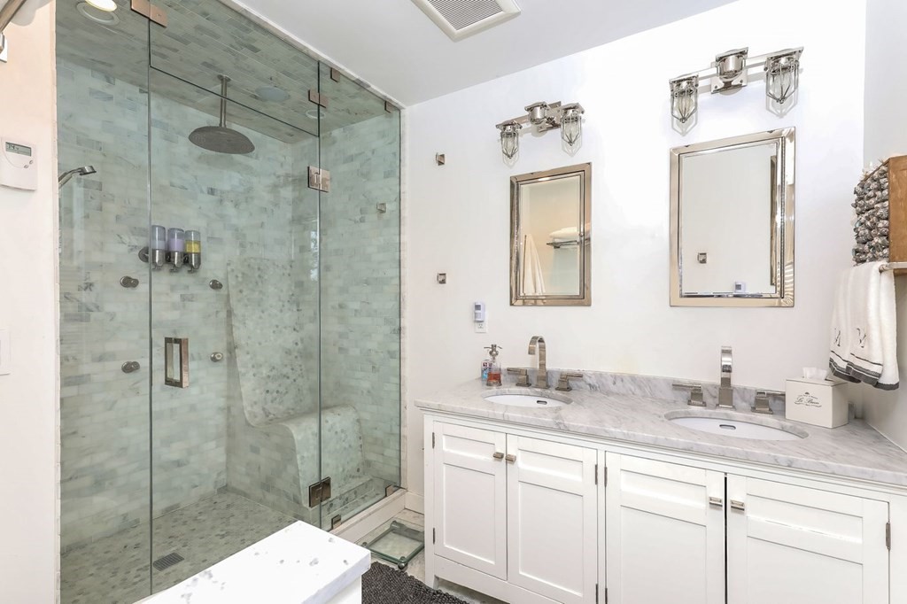 40 Dexter Road Marion, MA 02738 - Photo 15 of 27 a bathroom with a shower sink and mirror